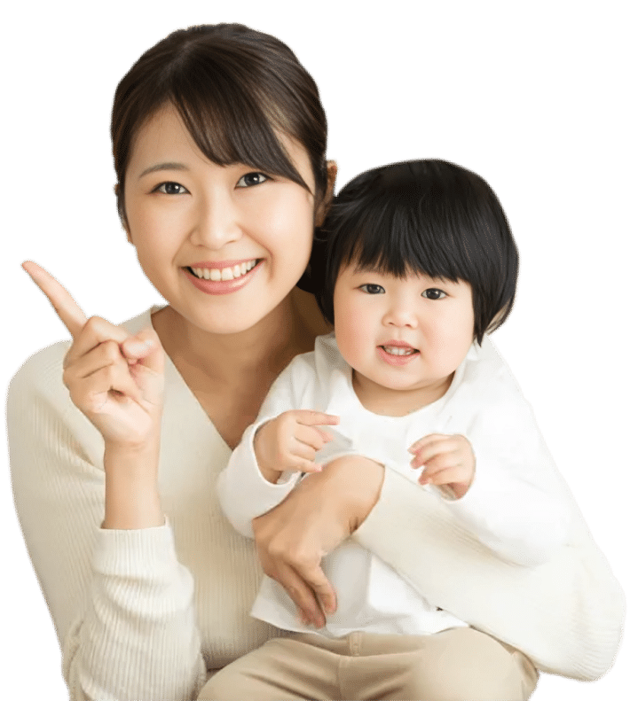 Woman and young child smiling together in white clothing against white background.